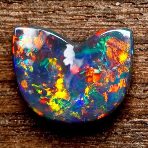 Experience the magic of Australian black opal rough, where the depths of the continent are captured in the natural play of vibrant colors.