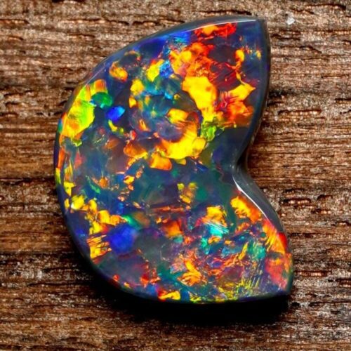 Experience the magic of Australian black opal rough, where the depths of the continent are captured in the natural play of vibrant colors.