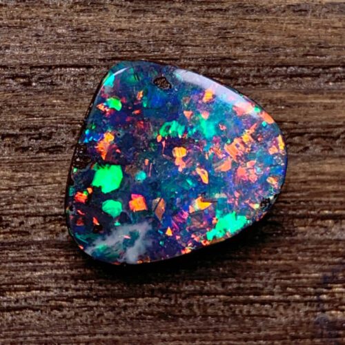 Uncover the hidden beauty of Australia's black opal rough, each stone capturing the deep allure and enchantment of the continent.