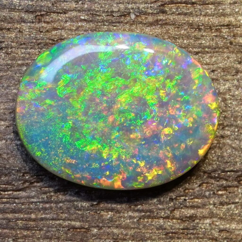 6.49cts, Full Face Pinfire Flash Australian Semi Black Opal