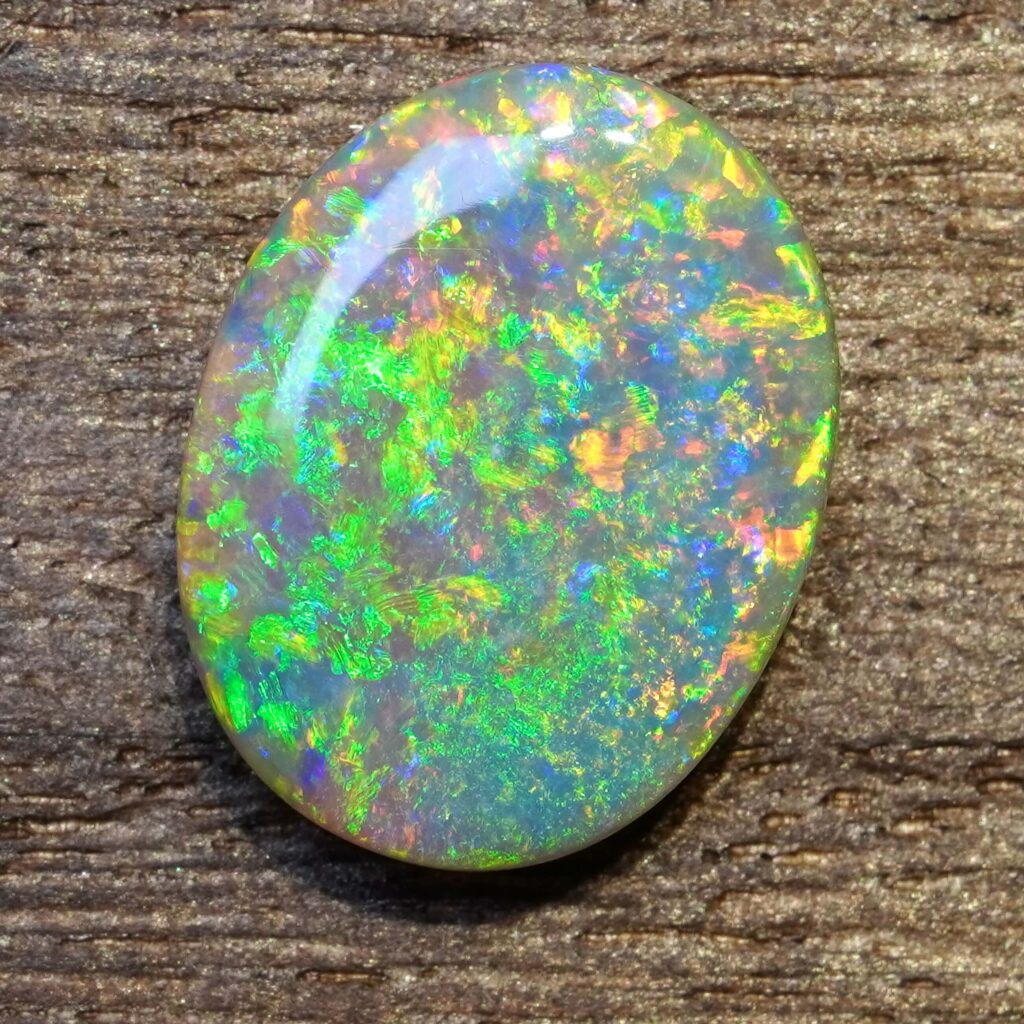 6.49cts, Full Face Pinfire Flash Australian Semi Black Opal