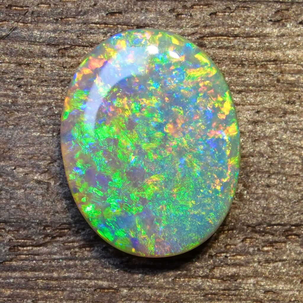 6.49cts, Full Face Pinfire Flash Australian Semi Black Opal